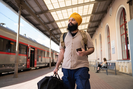 Person Walking At Train Station
