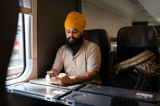 Man With Turban Using Cellphone