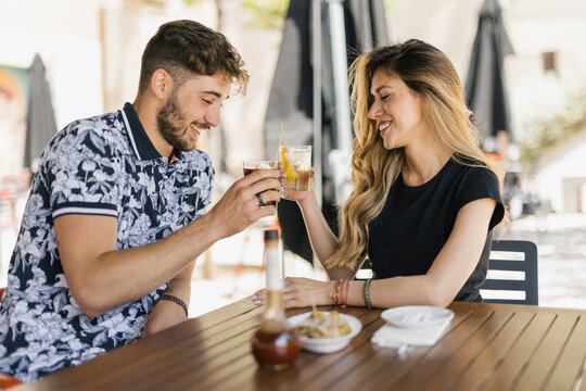 couple making vermouth in the bar