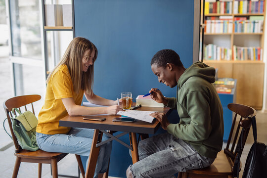 Two Young Students In Cafeteria