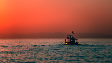 fishing boat at sunset on van lake