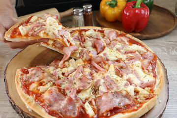 Homemade pizza topped with bacon and delicious.