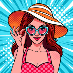 Woman in sunglasses and summer hat. Comic style, pop art vector illustration.