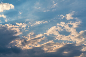 orange sunset sky with lighted clouds