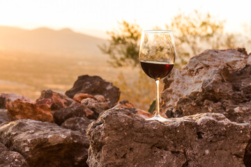 Wine glass at sunset on the mountain