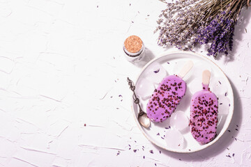 Purple Lavender flavored ice cream with flower bouquet, vintage silver spoon, ceramic stand
