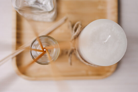 Lifestyle still life from the spa. Scented candle and fragrances. An atmosphere of relaxation and comfort. Hugge. Luxury beauty salon. Air freshener. Home perfume. Delicate tones. Calm and silence