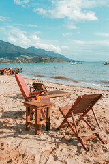Kiosk chairs in Ilhabela beach Brazil
