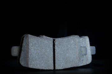 Vehicle parts. Auto motor mechanic spare or automotive piece on dark background. New metal car part. Repair and vehicle service with space for text.