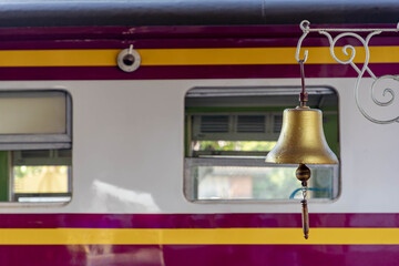Selective focus of gold bell at railway station, The bell is used to tell the signal to release the...