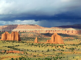 dramatic view of eroded red rock formations from the upper cathedral valley overlook on a stormy day, cathedral valley drive, capitol reef, utah - Powered by Adobe