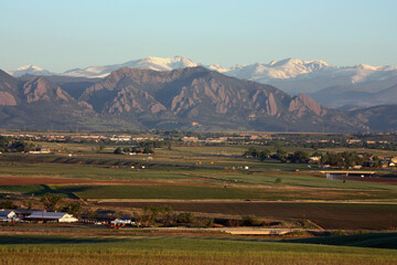 Colorado front range of the rocky mountains and Boulder FlatIrons  as seen  at sunrise in early summer from Broomfield, Colorado 