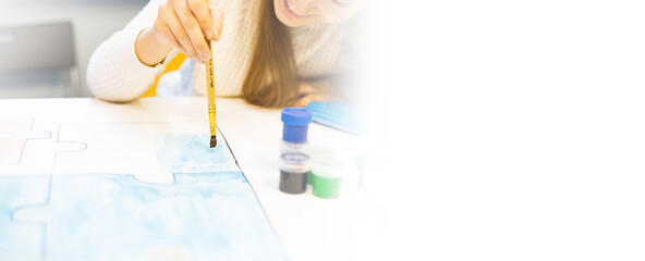 a person draws with a brush and paints on a large canvas in an art studio. creative, modern artist of fine art, a masterpiece of drawing, drawing training, art school, distance drawing courses, banner