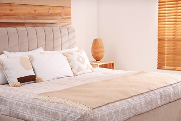Fototapeta premium Stylish hotel room interior with comfortable bed