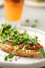 Bruschetta with avocado, herbs and seeds. Healthy wholesome food.