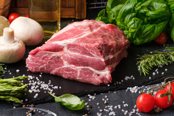 Raw meat on a black background.