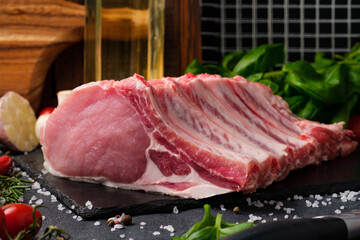 Raw meat on a black background.