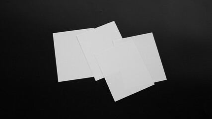 Blank Mock-up paper. brochure magazine isolated on black table, changeable background , white paper...