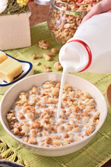 Fruit granola with milk in a bowl  