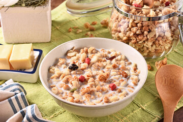 Fruit granola with milk in a bowl  