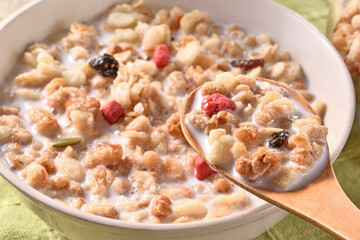 Fruit granola with milk in a bowl  