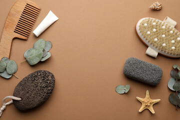 Fototapeta na wymiar Flat lay composition with pumice stones on brown background. Space for text