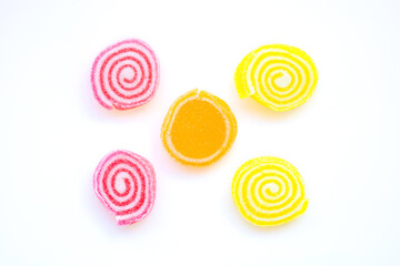 colorful sweets and sugar candies on a white background