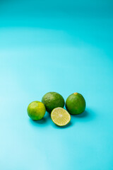 Limes on a blue background