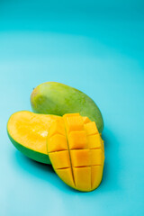 Mangoes on a blue background