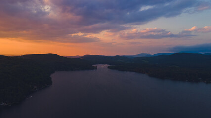 Sunset over the lake with colorful clouds