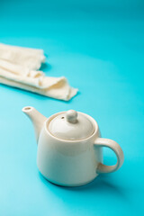 White ceramic teapot & white cloth