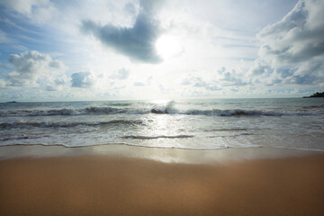 Fototapeta premium A beautiful landscape of the beach with white sea soft foam wave