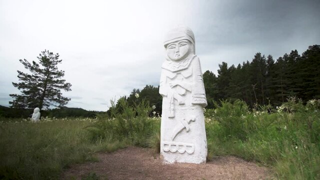 Traditional Kazakhstan Balbal Woman Sculpture Against Gloomy Sky In Burabay Borovoe National Park In Aqmola Region, Kazakhstan. - Wide Shot