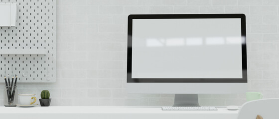 Modern workspace with computer, stationery, and decorations on the desk in white brick wall room, 3D render