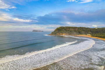 Early morning aerial views at the seaside with fog, cloud and waves