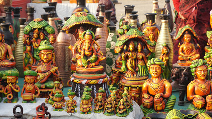Street shop of handmade statues of Indian idol at rural village annual fair.