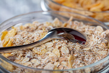 Oatmeal, muesli, cereals in a small glass plate.