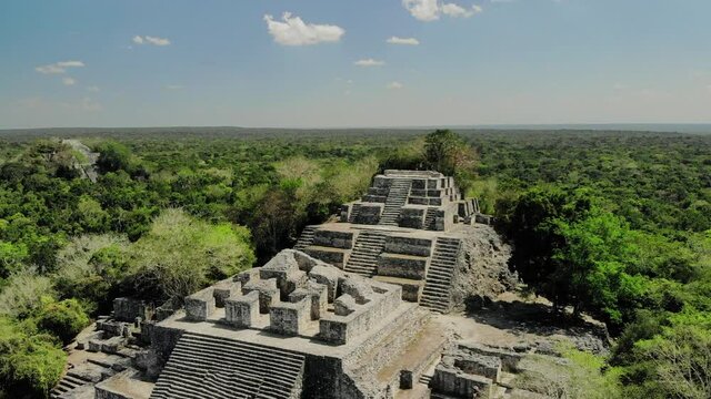 view of mayan pyramid temple in the heart of the jungle, stairway to heaven - view from drone