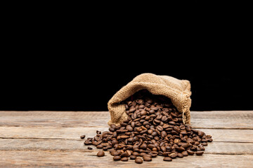 Coffee beans on wooden background