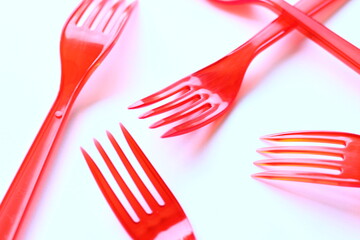 Plastic cutlery on a white background.