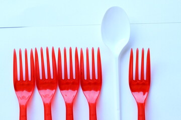 Plastic cutlery on a white background.