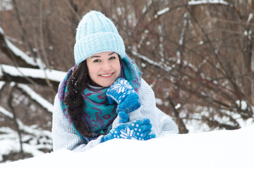 Fototapeta premium happy woman in winter rejoices in snowfall