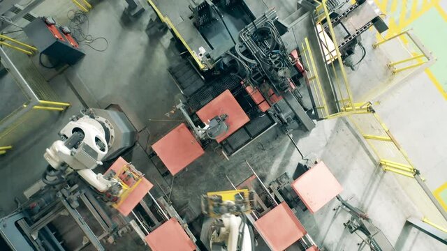 Copper sheets getting robotically transported in a top view