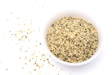 Organic shelled hemp seeds isolated on white background.