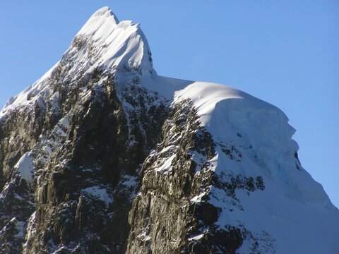 spectacular Antarctica peaks and iceberg on a sunny summer day in the neumayer channel in the palmer archipelago in  northern antarctica
