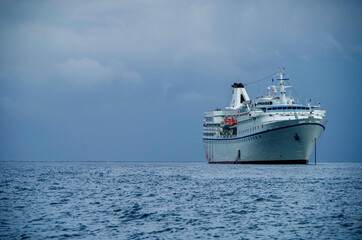 Small classic cruise ship cruiseship liner Ocean Majesty anchoring at sea during Mediterranean...