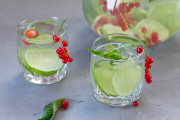 Homemade lemonade with lime, mint and berries. 