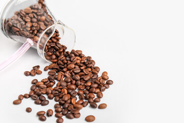 Cezve with coffee beans on white background