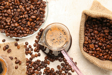 Composition with coffee beans on grunge background