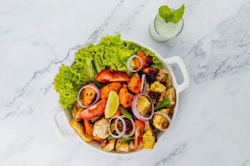 Chicken Tikka served on skewers